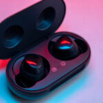 black wireless earbud with charging case