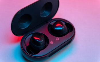black wireless earbud with charging case