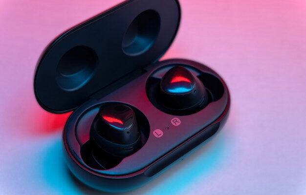 black wireless earbud with charging case